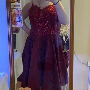 red flowy dress, back laces up, still has tags, size large